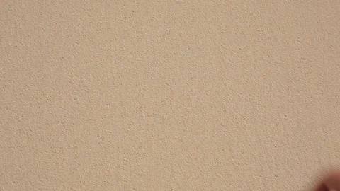Heart painted with hand on sand Stock Footage 93316672