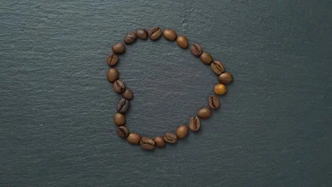 Heart pattern, made of roasted coffee beans. Stock Footage 155301027