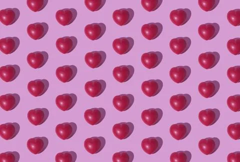 Heart pattern on pink background Stock Photos