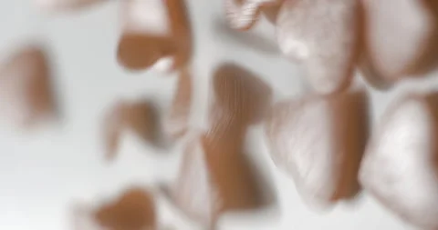 Heart pink decorative elements falling close up, studio vertical 4K Stock Footage 263686057