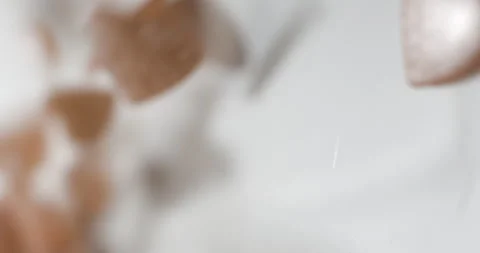 Heart pink decorative elements falling close up, studio vertical 4K Video stock 263686656