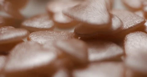 Heart pink decorative elements falling close up, studio vertical 4K Video stock 263715920