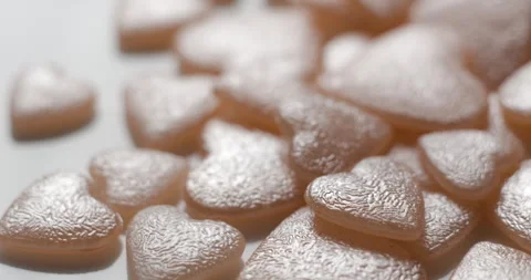 Heart pink decorative elements rotating close up, studio 4K Stock Footage 263686900