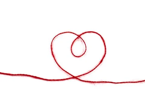 Heart from a red woolen thread on a white isolated background Stock Photos