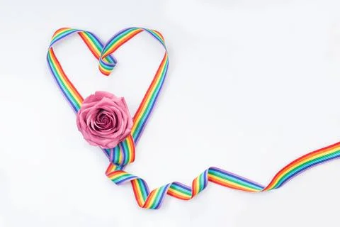 Heart from a ribbon with multi-colored lines and a rose. Color palette symbol Stock Illustration