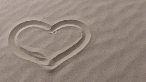 Heart in the sand Stock Footage 125403244