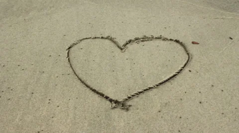 Heart in Sand Gets Washed Away Stock Footage 45716992