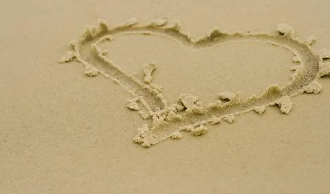 Heart on sand Stock Photos
