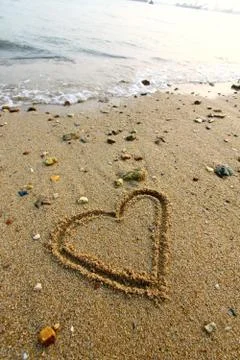 Heart on sand Stock Photos