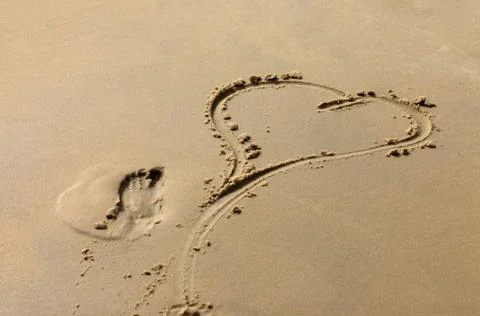 Heart on sand Stock Photos