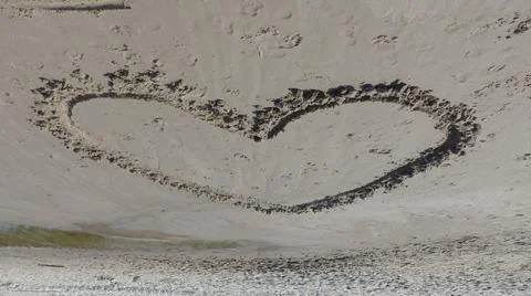 Heart on sand Stock-Fotos