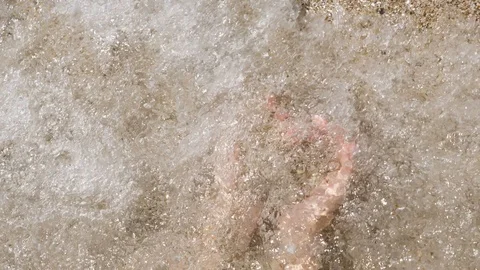 Heart Sand Through Fingers. the waves wash the sand from hands. Valentine's day Stock Footage 102274657