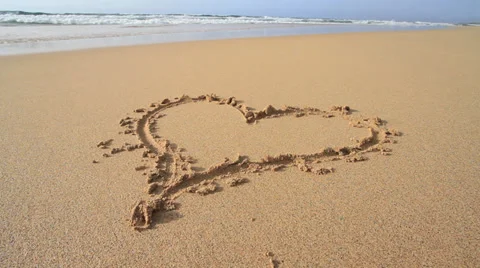 Heart on sandy beach 3 Stock Footage 27302992
