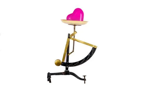 Heart on a scale Stock Photos