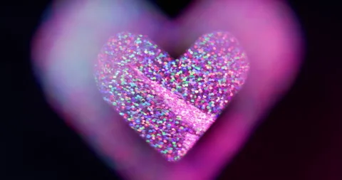 Heart sequins blur love shape neon lens flare Stock Footage 339783683