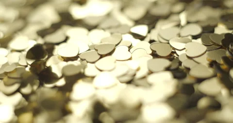 Heart sequins golden falling close up, studio 4K Stock Footage 263686897