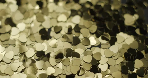 Heart sequins golden rotating close up, studio 4K Stock Footage 263687012