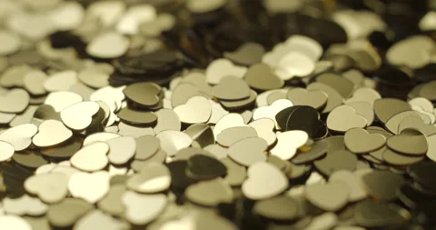 Heart sequins golden rotating close up, studio 4K Video stock 263687059