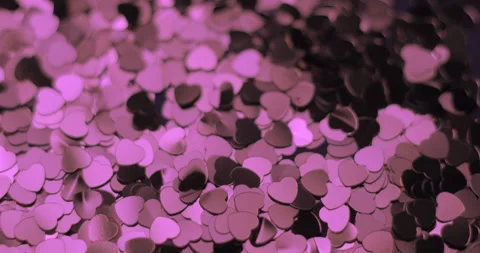 Heart sequins pink falling rotating, studio 4K Stock Footage 263686439