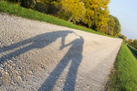 Heart shadow on the road Stock Photos