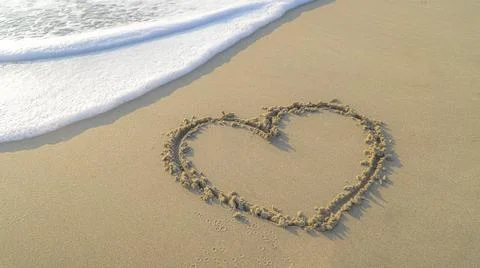 Heart shape on beach Stock Photos