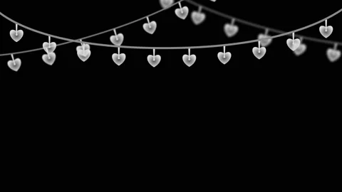 Heart shape blinking yellow light on black background Stock Footage 230169443