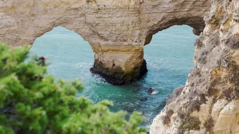 Heart shape cliffs in blue ocean Stock Footage 168973479