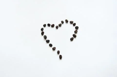 Heart shape from coffe beans. Top view. Stock Photos