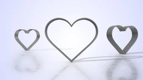 Heart Shape Cookie Cutters on a Light Reflective Floor. Stainless Steel Cutter. Stock Footage 305095506