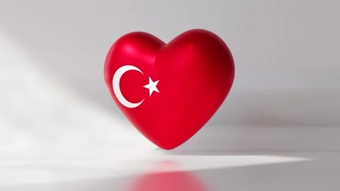 A heart shape displays the Turkish flag as it rotates Stock Footage 334740572