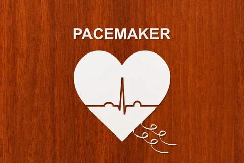 Heart shape with echocardiogram and PACEMAKER text. Cardiology concept Stock Photos