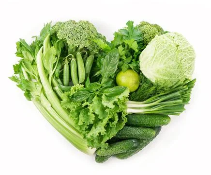 Heart shape form by vegetables isolated on the white background. Stock Photos