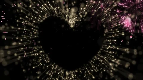 Heart shape formed by golden light particles and floating pink petals against 스톡 동영상 345332895