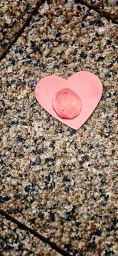 Heart shape found on a stone surface during a sunny afternoon Stock Photos