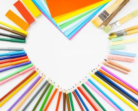 Heart shape frame from pencils, felt-tip pens and paper Stock Photos