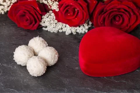 Heart Shape Gift Box, and red Roses bouquet Stock Photos