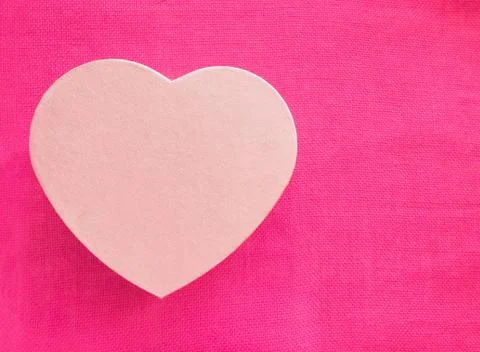 Heart shape gift box over pink background. Valentine's Day Gift. Top view Flat Stock Photos