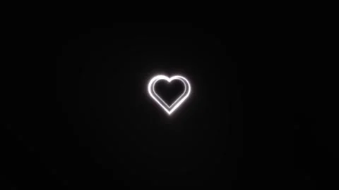 Heart shape glowing against a dark background with Stock Footage 338332848