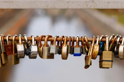 Heart shape love locks on bridge. Padlocks as symbol love and affection Stock Photos