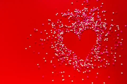 Heart shape made of candy on red background. Valentines Day concept Stock Photos