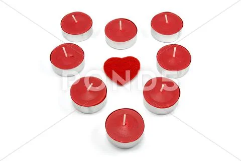 Heart shape made from red candles Stock Photos
