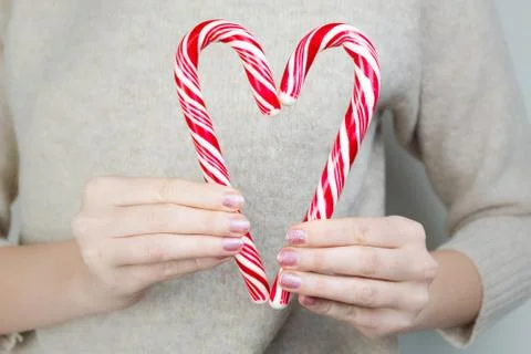 Heart shape made of two candy canes Stock Photos