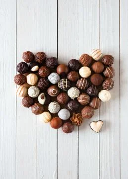 Heart shape made with various chocolate truffles Stock Photos