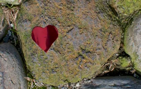 Heart shape over a stone Stock Photos