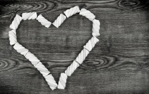 The heart shape pink marshmallows on background. Stock Photos