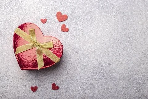 Heart shape red gift box with hearts on grey stone background, Valentine's Day Stock Photos