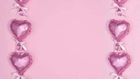 Heart shape romantic balloons passing on left and right side. Stop motion 스톡 동영상 190475188