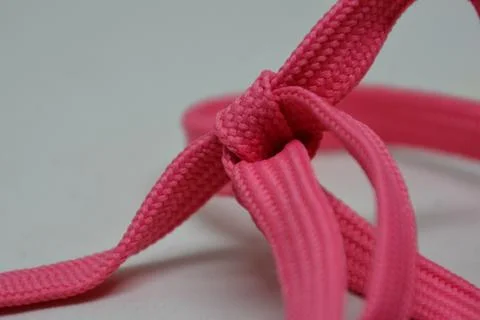 Heart shape rope knot, creative aesthetic romantic candy pink Stock Photos