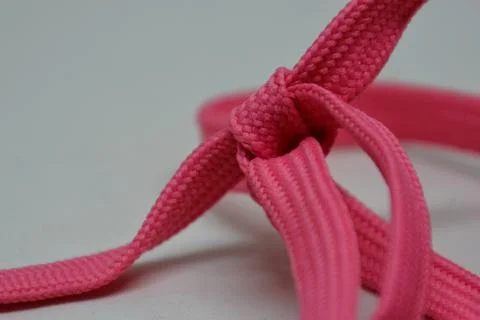 Heart shape rope knot, creative aesthetic romantic candy pink Stock Photos