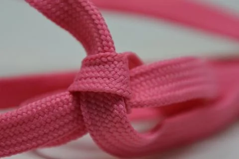 Heart shape rope knot, creative aesthetic romantic candy pink Stock Photos